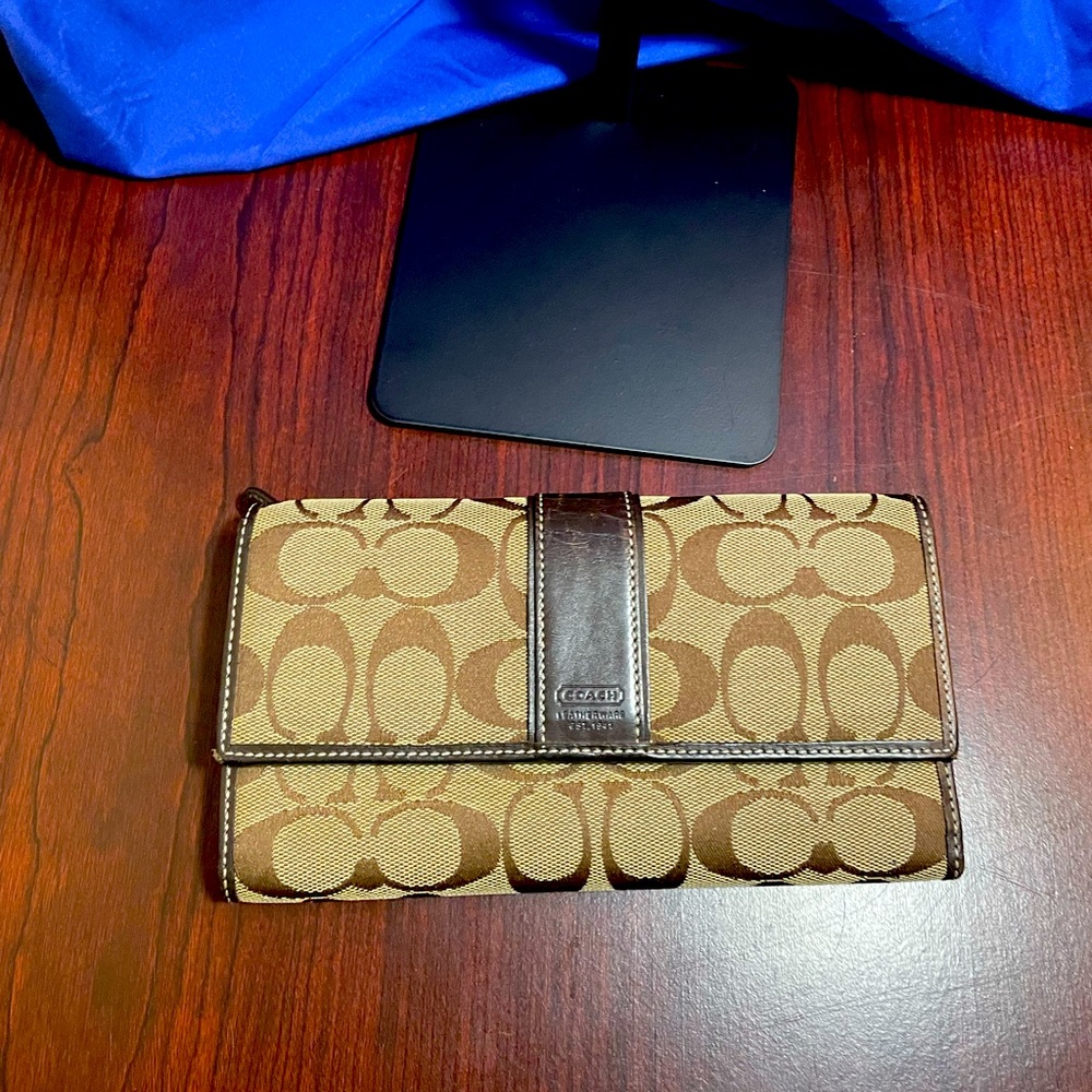 Coach tan/brown monogram wallet.  Good condition.